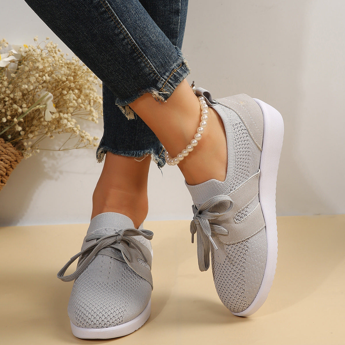 Lightweight knit sneaker with wide laces and flexible sole