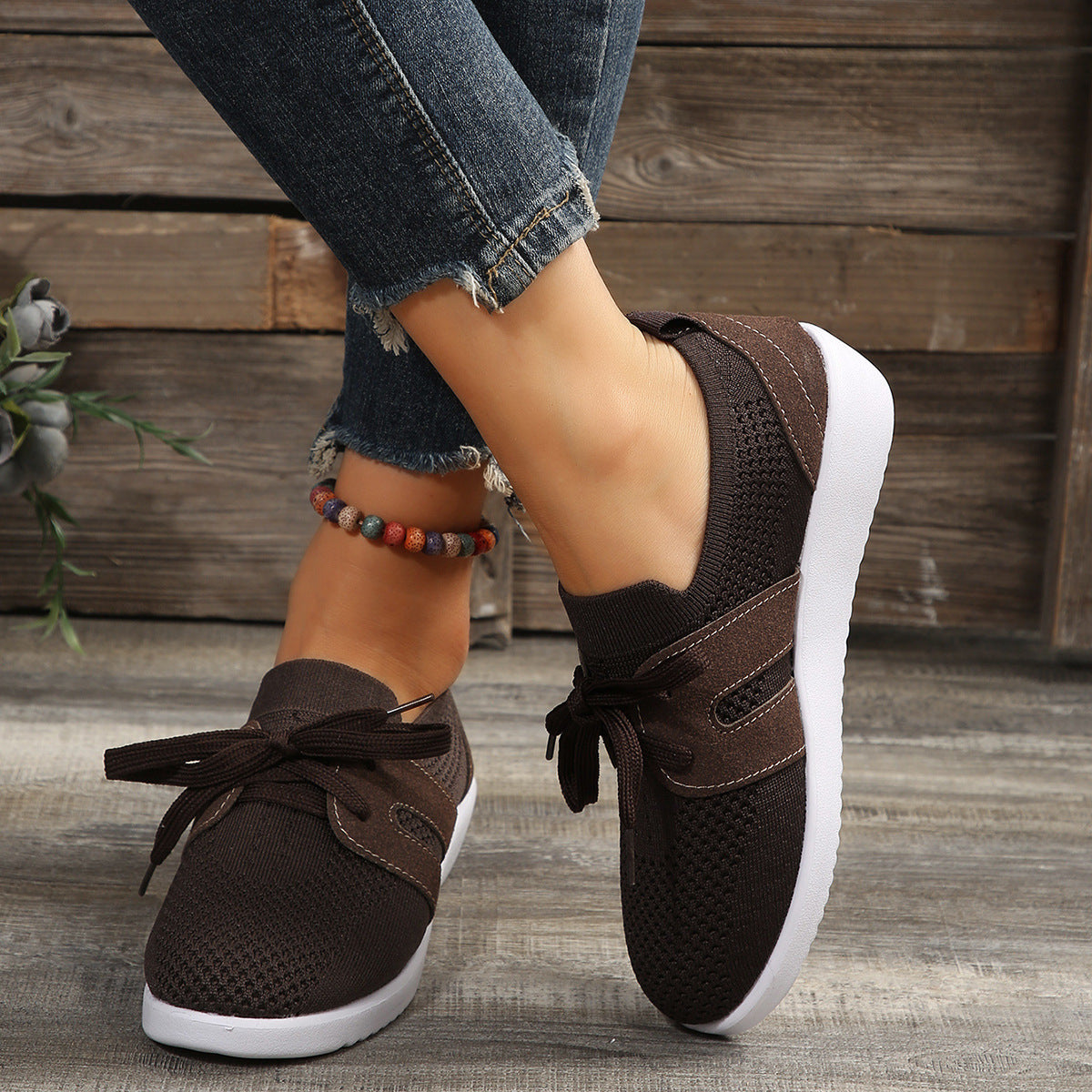 Lightweight knit sneaker with wide laces and flexible sole