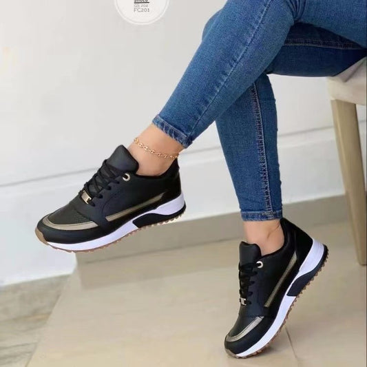 Lightweight everyday sneaker with smooth upper and cushioned insole
